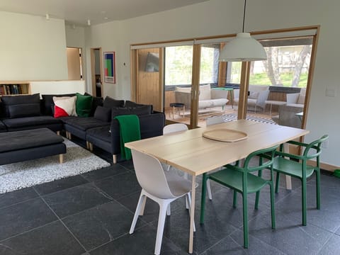 The Great Room includes dining, sofa system, fireplace, and kitchen, open porch.