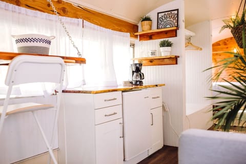 Mini fridge, coffee marker and cabinets for storage