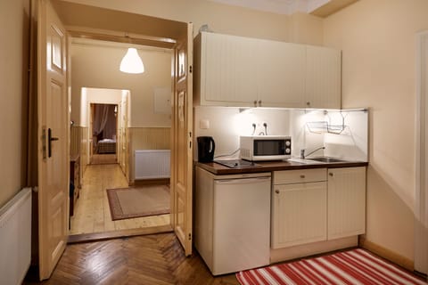 Exclusive Apartment, 2 Bedrooms, Private Bathroom | Private kitchenette | Fridge, electric kettle, highchair