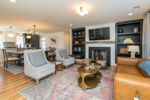 Experience our open-concept first floor where the kitchen seamlessly flows into the dining area and living room. Perfect for relaxing and entertaining, this space is designed for your comfort and enjoyment.