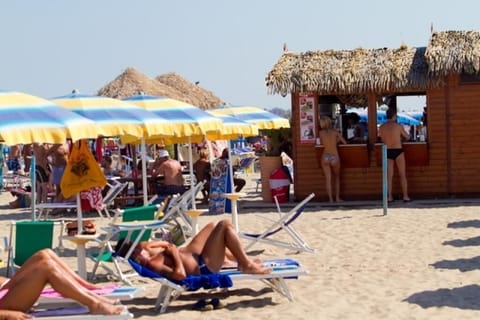 Private beach, white sand, beach umbrellas, beach volleyball