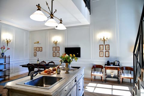 Property, Furniture, Cabinetry, Countertop, Picture Frame, Wood, Orange, Lighting, Kitchen Stove, Interior Design