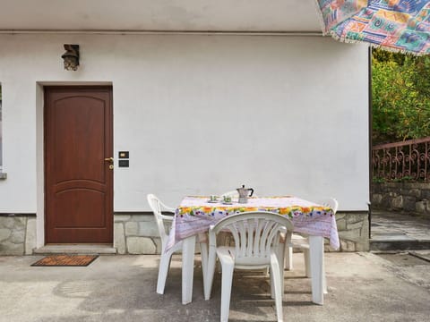 Table, Furniture, Door, Building, Chair, Outdoor Table, Wood, Tablecloth, Outdoor Furniture, Plant