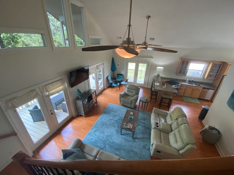 Living room with flat screen and recliner and sofas that all recline