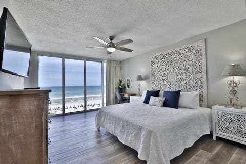 Gulf front master bedroom with a king size bed.