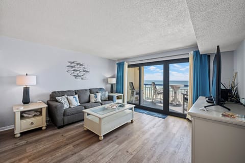 The ocean front living room is well-appointed with comfortable furnishings.