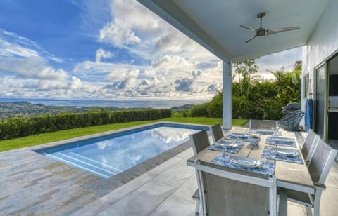 A stunning blend of the sky and pool area, creating a serene and picturesque view.