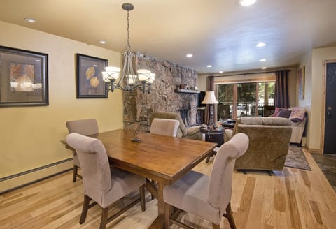 Dining/Living Room with fireplace and balcony