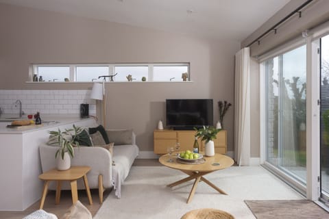 Living area with smart TV and coffee tables leading onto the kitchen - Salt Life, Dunes at Upton Towans