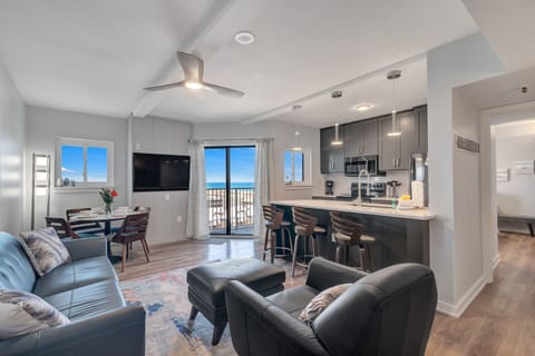 An inviting open-concept living, dining and kitchen areas, perfect for entertaining or relaxing in style.