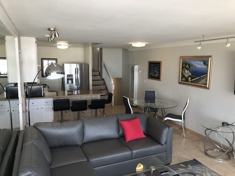 Dining area includes a round table and granite bar that can seat 10 plus.