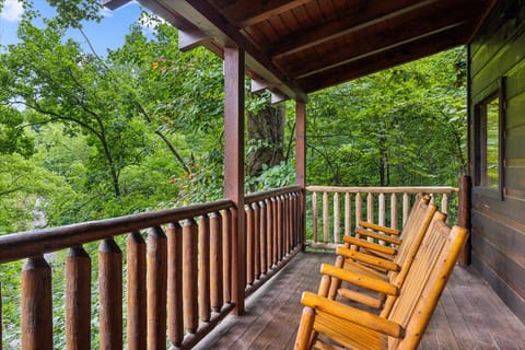 Unwind on the patio after a day of exploring the top attractions of Gatlinburg at Brave Eagle | Great Smoky Mountains Cabin Rentals | Gatlinburg Cabin Rentals | Pigeon Forge Cabin Rentals | Cabins with Hot Tubs | Smoky Mountain Rentals
