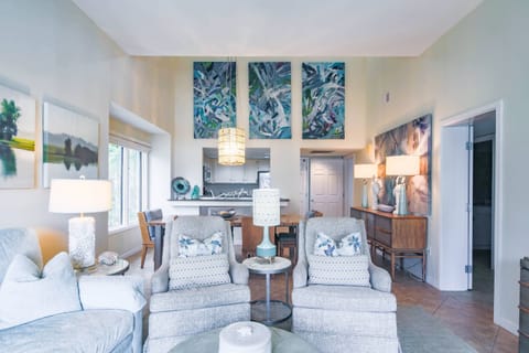 There is an open floor plan layout between the living room, dining area and kitchen.