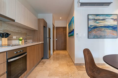 Cook a savory meal in our full kitchen with granite countertops, and let the fresh air from the open balcony doors add to the experience