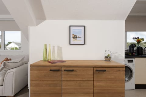 Storage space in between open-plan kitchen and living area - Bridge Apartment