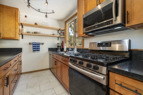 Compact yet efficient galley kitchen w/ stainless steel appliances