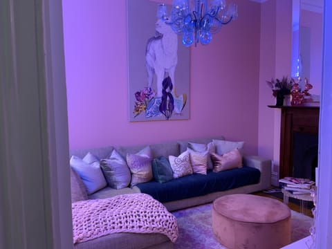 Living room with original art.  63in 4K TV with Netflix, Stan etc.