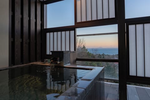 Japanese Western Style Twin Room, Ocean view with Open-air bath (Second floor) | Bathroom | Separate tub and shower, deep soaking tub, free toiletries, hair dryer