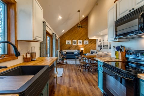 Newly updated kitchen has a farmhouse sink, new fixtures, butcher block counters