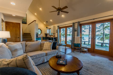 Large ceiling to floor windows provide Lake and outdoor views from main area. 