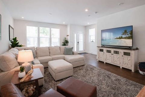 Bright and cozy living space with a smart TV and natural light, perfect for relaxing after a day of exploring.