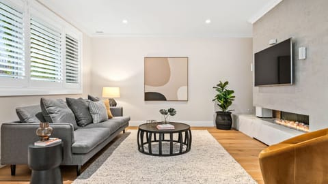 Main living with gas fireplace and smart tv 