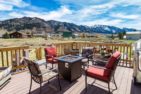 Deck with firepit, barbeque and view of the mountains.