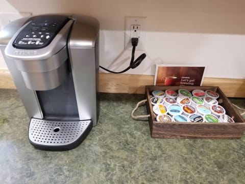 Keurig coffee maker with assorted k-cups.