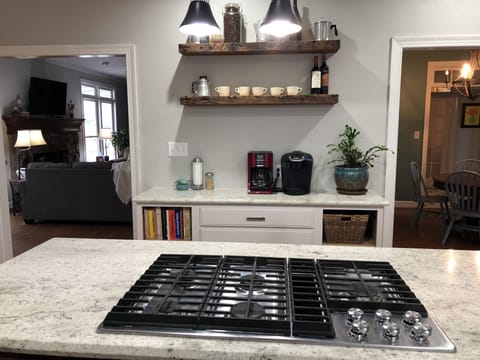 Coffee bar and gas range. Open to den and dining area.