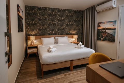 Standard Double Room | Minibar, desk, laptop workspace, blackout drapes