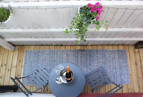 Private, decked outdoor area with garden table and chairs