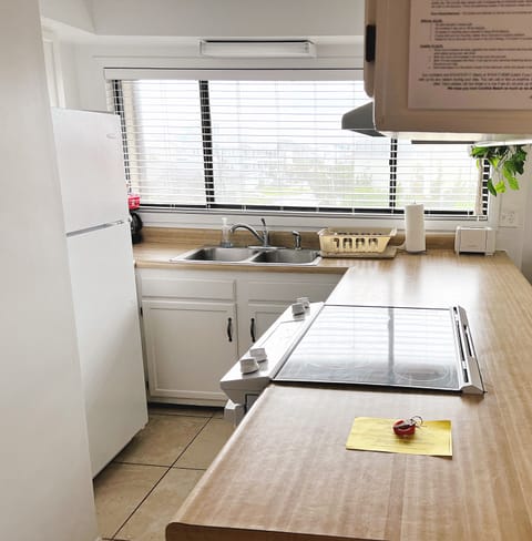 Kitchen with microwave, oven, dishwasher, and with a new fridge added June 2023.