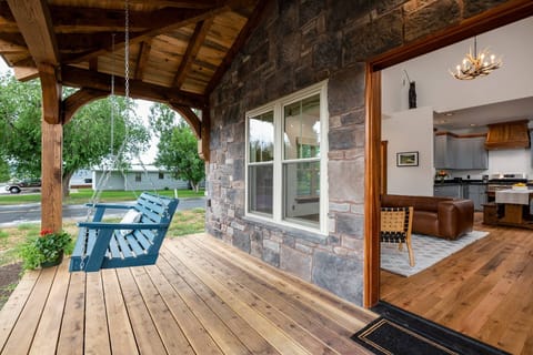 Enjoy the peace and beauty from the front porch swing.
