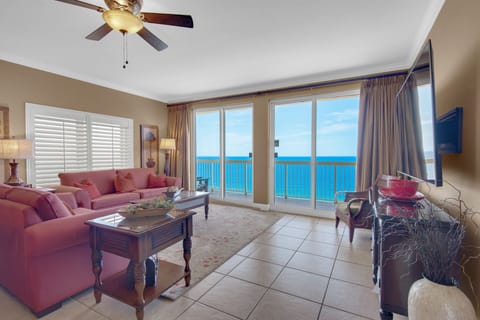 Living Room - This luxurious beachfront living room offers ultimate comfort, a spacious layout, a large flat-screen TV, and endless ocean views for the perfect retreat.