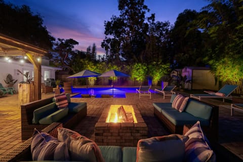 Backyard lit up at night for resort style vibes