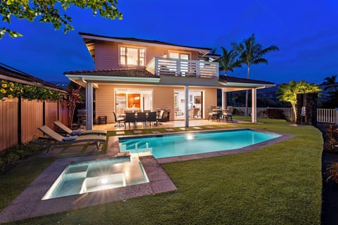 Relax poolside in the warm glow of a Hawaiian sunset.