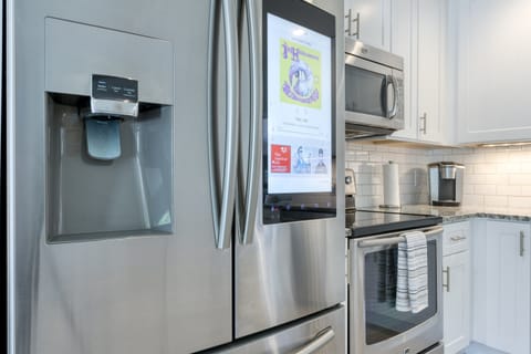 Open plan upgraded kitchen with marble counter tops, stainless steel appliances & Smart Fridge!