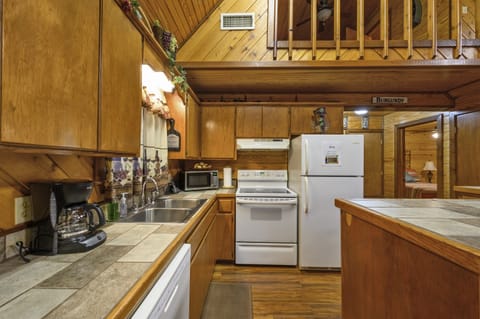 The kitchen has full size appliances, including a dishwasher.