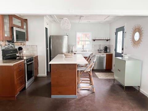 A view of the kitchen and main entrance door