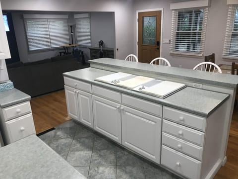 Electric cook top; griddle on the left along with four heat elements.