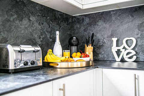 The fully equipped kitchen provides everything you need to prepare a delicious home-cooked meal, with modern appliances, ample cookware, and all the essential utensils to make cooking easy and enjoyable during your stay.