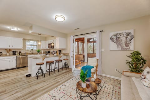 A smaller living room opens up to the kitchen and screened-in porch.
