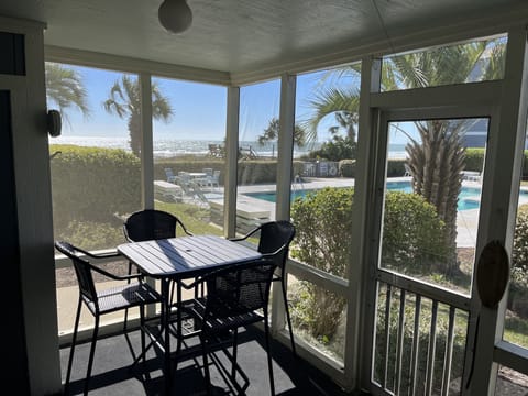 View of the pool and beach from the screened-in porch!