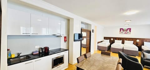 Family Room, City View | Iron/ironing board, free WiFi, bed sheets