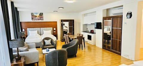 Family Room, City View | Iron/ironing board, free WiFi, bed sheets