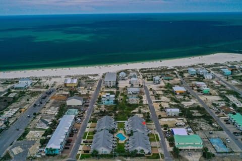 Aerial view of the beautiful waters of Mexico Beach with the red star indicating the location of this property.