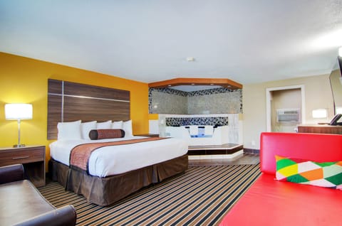 Honeymoon Suite, 1 King Bed | Living area | LED TV
