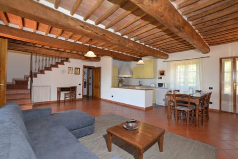 The living room with dining area and kitchen corner in the apartmnent 1