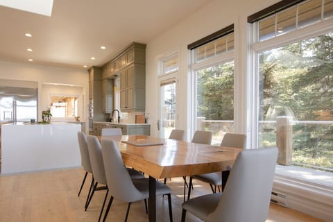 Dining room with a forest and ocean view