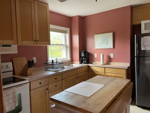This cozy kitchen is well equipped~  a new Cuisinart Coffee maker and grinder.